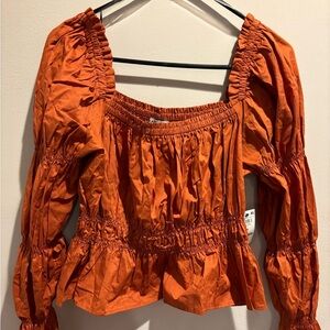 Size 0x and now brand long sleeve top.